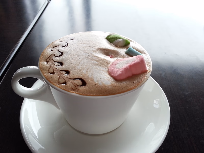 A cappuccino with a whimsical touch of candy and a touch of creativity.